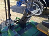 a close up of a green tractor with a steering wheel
