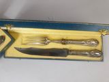 a box with a knife, fork, and spoon in it