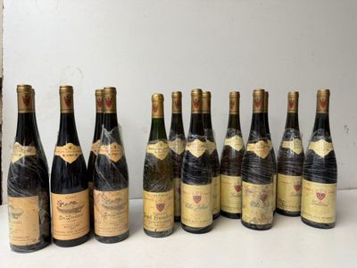 several bottles of wine are lined up on a table