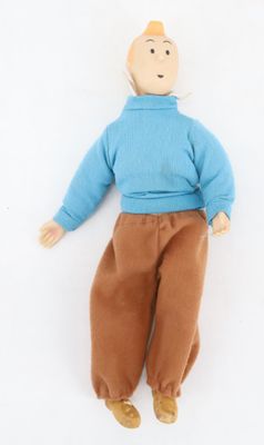 an image of a stuffed toy of a man laying on a white surface