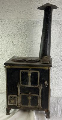 a black stove sitting on a white table