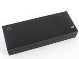 a close up of a black box on a white surface