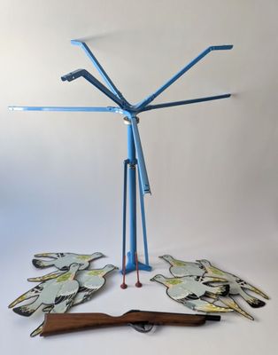 a sculpture made out of paper and scissors on a table