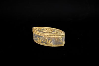 a gold and silver box with a design on it