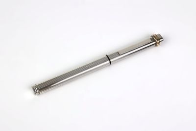 a close up of a metal screw on a white surface