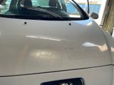 a white car that is parked in a garage