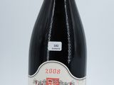 a bottle of wine that is sitting on a table