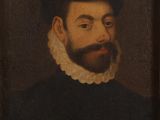 portrait d'un homme barbu vêtu d'un manteau noir et d'un col blanc