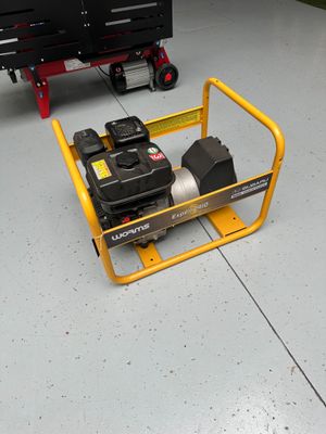 a small yellow cart with a small engine on it