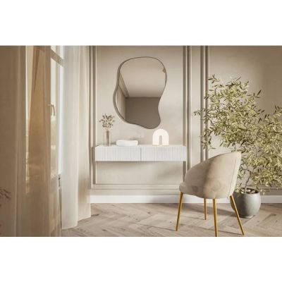 an image of a chair in a room with a mirror on the wall