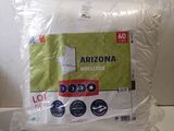 the pillow is wrapped in plastic and sitting on the counter