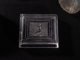 a glass box with a picture of a man and a woman on it