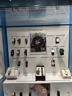 many watches on display in a glass case