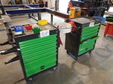 two green and black work benches in a warehouse