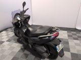 a motorcycle that is parked on a checkered floor