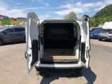 a white van with its doors open in a parking lot