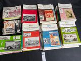 a lot of books that are sitting on a table