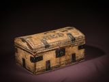 a small wooden chest with a metal latch on it