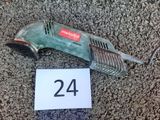 a picture of a corded drill on the ground