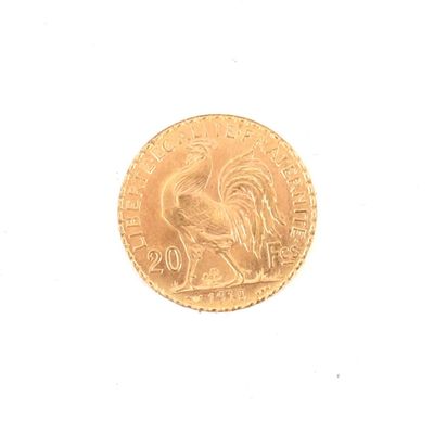une pièce d'or sur laquelle est représenté un coq