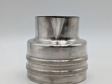 an old silver vase with a metal top on a white surface