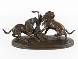 une image représentant une statue en bronze de deux chiens en train de se battre