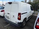 a white van that is parked in a parking lot