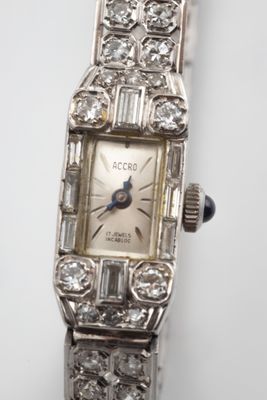 an image of a close up of a watch on a white surface