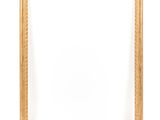 a gold frame on a white wall with a white background