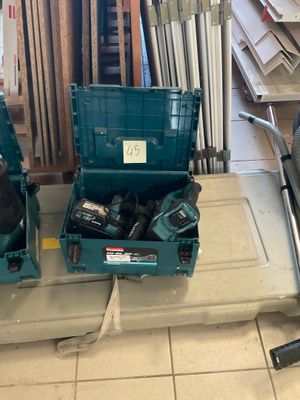 two blue tool boxes sitting on the floor next to each other