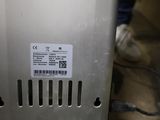 a close up of a metal device with a label on it