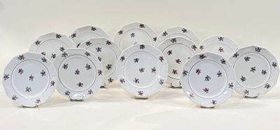 six plates with black and white designs on them on a white surface