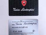 a close up of a business card with a ferrari logo on it