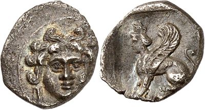 a silver coin with an image of a man and a woman