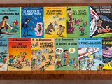 several children ' s books are lined up on a wooden table