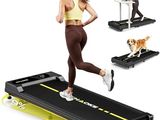 the woman is running on the treadmill with her dog