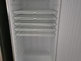 an open refrigerator that is sitting in a kitchen