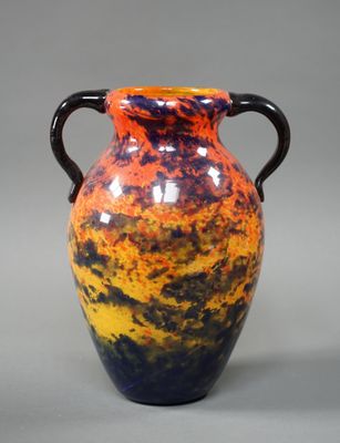 a vase that is sitting on a table with a gray background