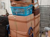 many boxes stacked on top of each other on a cart