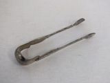 a pair of tonges that are on a table