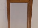 a small wooden table with a tile top on it