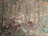 a tapestry with a picture of a man and a dog in the woods