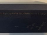 a black box with a clock on top of it