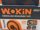 two boxes of wokin tape sitting on top of a table