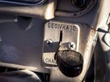 a close up of a motorcycle ' s dashboard with the control button