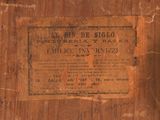 an old wooden box with a sign on it
