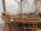 a model of a ship on display in a glass case