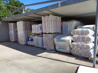 a lot of bags of toilet paper in the back of a truck