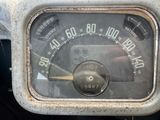 a close up of a speedometer in a car