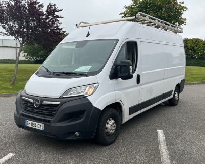 a white van parked in a parking lot in a parking lot